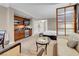 Living area with kitchenette, sofa, and room divider at 135 E Harmon Ave # 2515, Las Vegas, NV 89109