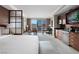 Main bedroom featuring wet bar, seating area, desk, city views, and modern amenities at 135 E Harmon Ave # 2515, Las Vegas, NV 89109