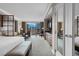 Comfortable main bedroom featuring a wet bar, desk, seating area, and city views at 135 E Harmon Ave # 2515, Las Vegas, NV 89109