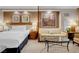 A bright bedroom with a comfortable sofa and art piece at 135 E Harmon Ave # 2515, Las Vegas, NV 89109