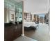 Inviting main bedroom with wet bar, desk, seating, and large window with city views at 135 E Harmon Ave # 2515, Las Vegas, NV 89109