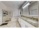 Bathroom featuring double sinks with granite counters, a separate shower, and a bathtub at 1862 Redwood Valley St, Henderson, NV 89052