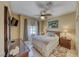 Bedroom featuring a ceiling fan, a queen-sized bed, and a window at 1862 Redwood Valley St, Henderson, NV 89052