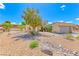 Desert landscaping surrounds this single-story home featuring a tile roof and attached two-car garage at 1862 Redwood Valley St, Henderson, NV 89052