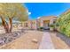 Lovely single-story home with desert landscaping, rock accents, and a pathway to the front door at 1862 Redwood Valley St, Henderson, NV 89052