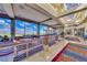 Hallway with interior seating and views of the community's landscaped golf course with large viewing windows at 1862 Redwood Valley St, Henderson, NV 89052