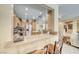 Kitchen eat-in counter with stone countertops and wood cabinets, offering lots of storage at 1862 Redwood Valley St, Henderson, NV 89052