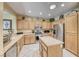 Bright kitchen with lots of cabinet space, an island, stainless appliances, and granite countertops at 1862 Redwood Valley St, Henderson, NV 89052