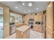 Bright kitchen boasts stone countertops, stainless steel appliances, and a functional island at 1862 Redwood Valley St, Henderson, NV 89052