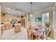 Bright kitchen features wood cabinets, stainless steel appliances, an island, and an adjacent dining area at 1862 Redwood Valley St, Henderson, NV 89052