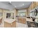 Open kitchen features stainless steel appliances, countertops, and functional island space at 1862 Redwood Valley St, Henderson, NV 89052