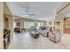 Spacious living room featuring tile flooring and an open floor plan leading into the dining and kitchen areas at 1862 Redwood Valley St, Henderson, NV 89052