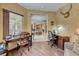 The office features wood floors, a desk, and an adjacent living area at 1862 Redwood Valley St, Henderson, NV 89052