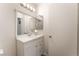 Neat bathroom featuring a vanity with ample storage, a well-lit mirror, and clean design at 221 Mission Catalina Ln # 104, Las Vegas, NV 89107