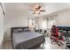 Bright bedroom with a comfortable bed, ceiling fan, and a well-lit workspace at 221 Mission Catalina Ln # 104, Las Vegas, NV 89107