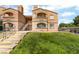 Beautiful two-story apartment complex with well-maintained landscaping and visible unit numbers at 221 Mission Catalina Ln # 104, Las Vegas, NV 89107