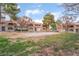 Apartment complex with well-maintained grounds and mature trees at 221 Mission Catalina Ln # 104, Las Vegas, NV 89107