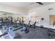 Spacious gym featuring a full mirror, exercise bikes, a weight rack, and ample equipment at 221 Mission Catalina Ln # 104, Las Vegas, NV 89107