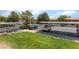 A community parking area shows covered spots available in a neighborhood with a lot of greenery at 221 Mission Catalina Ln # 104, Las Vegas, NV 89107
