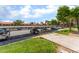 View of the community parking with covered parking spots in a well maintained complex with greenery at 221 Mission Catalina Ln # 104, Las Vegas, NV 89107