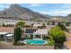 Backyard with sparkling swimming pool, spa, and mountain views at 2728 Faiss Dr, Las Vegas, NV 89134