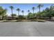 Community clubhouse featuring mature trees, lawn, and fountain at 2728 Faiss Dr, Las Vegas, NV 89134