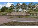 Pinnacle Community Center sign with lush landscaping, golf course & Summit Restaurant at 2728 Faiss Dr, Las Vegas, NV 89134
