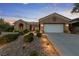 Beautiful single-story home featuring a well-manicured front yard and a convenient two-car garage at 2728 Faiss Dr, Las Vegas, NV 89134