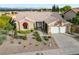 Charming single-story home featuring a well-manicured front yard and an attached two-car garage at 2728 Faiss Dr, Las Vegas, NV 89134