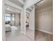 Bright hallway with mirrored closet doors leading to a bedroom with a scenic view at 2728 Faiss Dr, Las Vegas, NV 89134