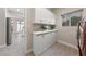 Laundry room offers ample storage with white cabinets and a view through the window at 2728 Faiss Dr, Las Vegas, NV 89134