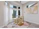 Bright sunroom with chess table, gold accents, and beautiful backyard view at 2728 Faiss Dr, Las Vegas, NV 89134