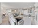 Bright living space with fireplace, open floor plan, and modern finishes, flowing into dining and kitchen at 2728 Faiss Dr, Las Vegas, NV 89134