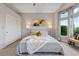 Serene main bedroom featuring plush bedding, soft lighting, and an inviting window bench at 2728 Faiss Dr, Las Vegas, NV 89134