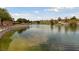 Scenic pond with paved walking path and railing at 2728 Faiss Dr, Las Vegas, NV 89134