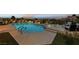 Relaxing pool area with inset spa, lush greenery, and comfortable seating for entertaining guests at 2728 Faiss Dr, Las Vegas, NV 89134