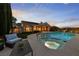 Inviting backyard oasis featuring a sparkling pool, inset spa, and comfortable outdoor seating at 2728 Faiss Dr, Las Vegas, NV 89134