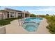Gorgeous pool with a spa and diving board, complemented by lush landscaping and an open patio at 2728 Faiss Dr, Las Vegas, NV 89134