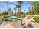 Scenic community putting green surrounded by manicured landscaping and mature trees at 2728 Faiss Dr, Las Vegas, NV 89134