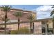 Exterior angled view of Red Rock Casino featuring tall palm trees and a cloudy sky at 2728 Faiss Dr, Las Vegas, NV 89134