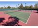 Community tennis courts in a lush green and fenced recreational area at 2728 Faiss Dr, Las Vegas, NV 89134