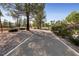 Well-maintained walking path lined with trees and landscaping at 2728 Faiss Dr, Las Vegas, NV 89134