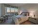 Serene bedroom with floor-to-ceiling windows showcasing stunning city and mountain views, plus elegant furnishings at 2877 Paradise Rd # 2502, Las Vegas, NV 89109