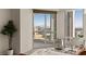 Bright bedroom featuring stunning city views from windows at 2877 Paradise Rd # 2502, Las Vegas, NV 89109