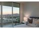 A well-appointed bedroom features a skyline view from a private terrace at 2877 Paradise Rd # 2502, Las Vegas, NV 89109
