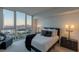 Beautiful bedroom with a large picture window offering a stunning view of the city and mountains beyond at 2877 Paradise Rd # 2502, Las Vegas, NV 89109