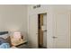 A bedroom features a closet with sliding doors and a decorative plant at 2877 Paradise Rd # 2502, Las Vegas, NV 89109