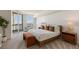 Bright bedroom boasts floor-to-ceiling windows with city views, a plush bed, and stylish modern furnishings at 2877 Paradise Rd # 2502, Las Vegas, NV 89109