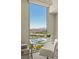 The clear glass desk top in front of this home's window offers a fabulous view of the city and mountains at 2877 Paradise Rd # 2502, Las Vegas, NV 89109