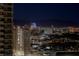 Picturesque city view capturing the iconic Sahara Hotel and the distant mountain range at night at 2877 Paradise Rd # 2502, Las Vegas, NV 89109